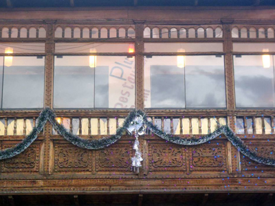 Balcony of Pirwa Restaurant in Cusco - The colonial balcony of Pirwa Restaurant in the main square of Cusco, decorated for Christmas