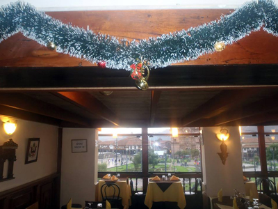 The Main Square seen from Pirwa Restaurant in Cusco  - Christmas decorations in Pirwa Restaurant in Cusco and a view overlooking the main square.
