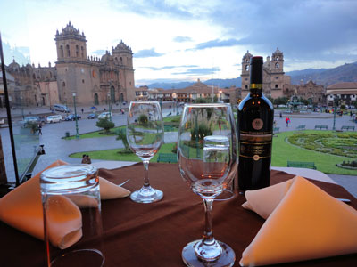 Pirwa Restaurant Balcony View - Wine in the colonial balcony of Pirwa Restaurant, overlooking the Plaza de Armas (or main square) of Cusco.