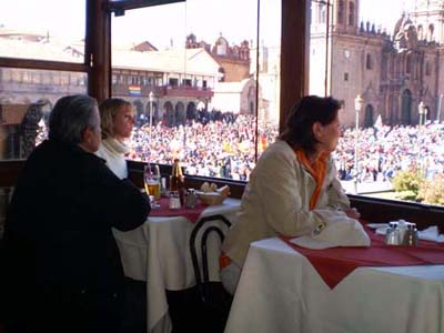 View of the main square of Cusco from Pirwa Restaurant - Watching dances and processions in the Plaza de Armas (main square) of Cusco, Peru, from the balcony of Pirwa Restaurant